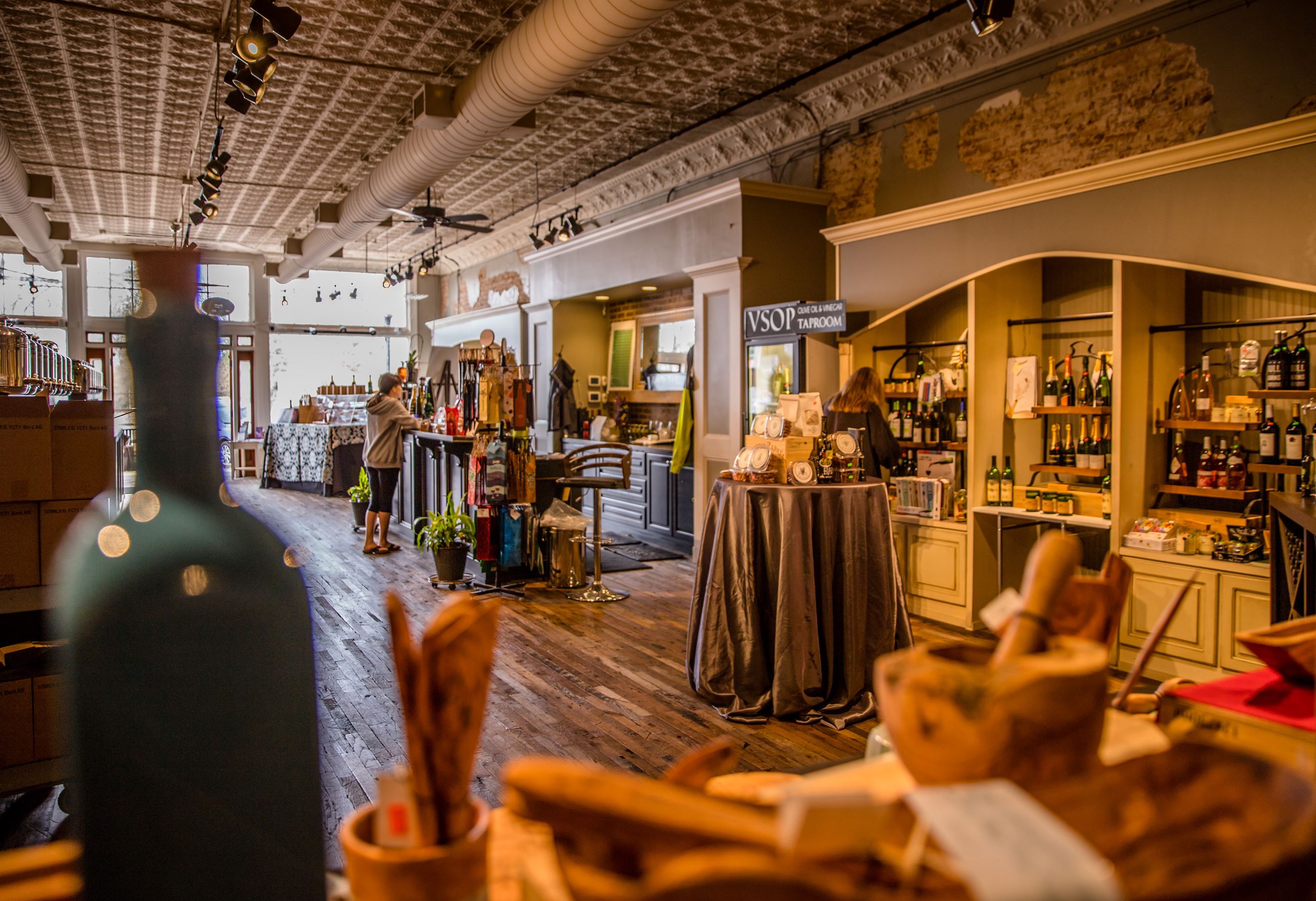 olive oil, vinegar and bakery goods in small boutique shop
