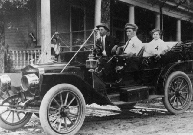 old black and white photo of family in convertible car in Norcross