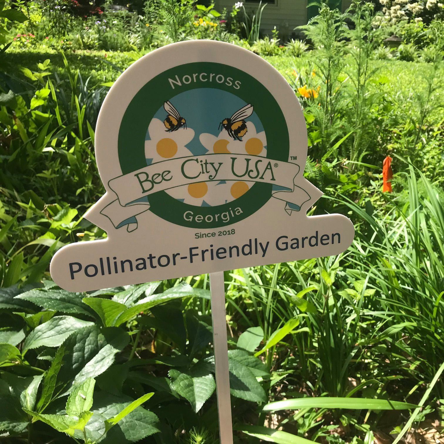 norcross pollinator-friendly garden sign in raised garden bed